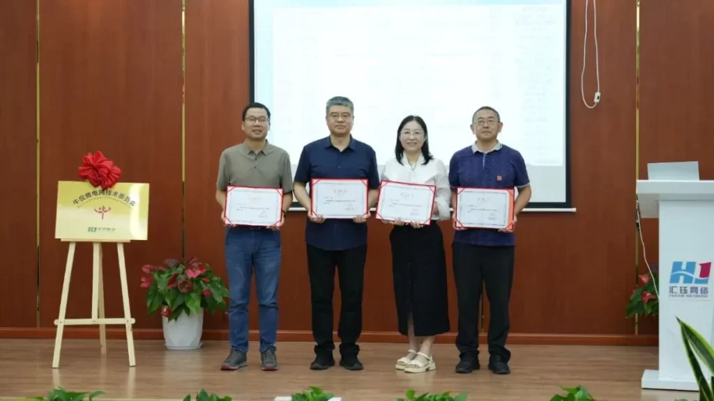 Director (first from the right) and Deputy Directors (first to third from the left) presenting certificates